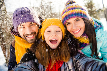 Photo of cheerful family mom dad kid happy positive smile make selfie fly air snow winter trip outdoors