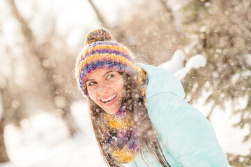 Fototapeta na wymiar Photo of young cheerful woman happy positive toothy smile snowy walk park winter dream look empty space