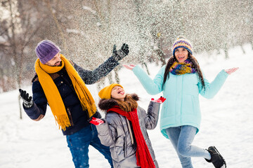 Photo of cheerful family happy positive smile have fun enjoy time together playful fly air snow walk park