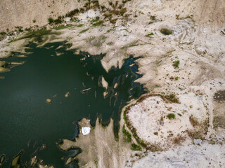 Flooded abandoned construction site. Aerial drone view.