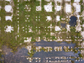 Flooded abandoned construction site. Aerial drone view.