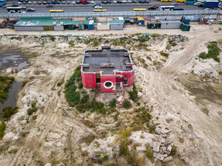 Flooded abandoned construction site. Aerial drone view.