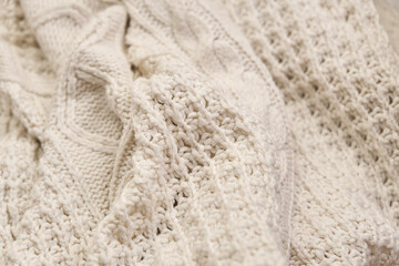 Fototapeta na wymiar Hand made cable-knit sweater sweater close up