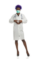 Black Female Doctor In Surgical Mask Is Standing And Showing Heart Hand Sign. Full Length, Isolated.