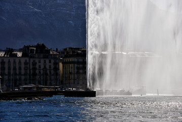 Jet d'Eau fountain (powered by jet engine) on Lake Geneva, city center of Geneva, Saleve mountain...