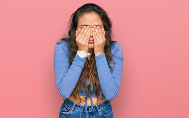 Young hispanic girl wearing casual clothes rubbing eyes for fatigue and headache, sleepy and tired...