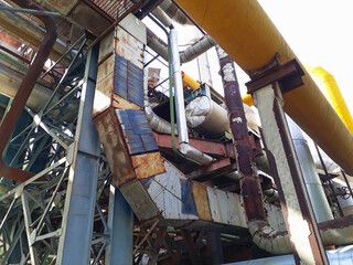 Old and rusty pipes, tubes and machinery at power plant