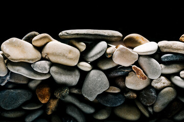 Colorful sea pebbles close-up. Background texture, sea stones in the water