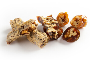 Walnuts on a string dipped in starch grape molasses. Churchkhela. Walnut sujuk.