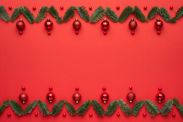 Christmas card with holiday decorations on red background