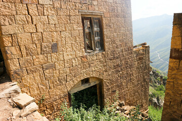 abandoned house of ancient village Gamsutl in Dagestan that lost in the mountains