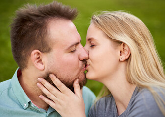 Fototapeta premium Young happy millennial couple kissing - Teenager girl touching his boyfriends's face - Love concept