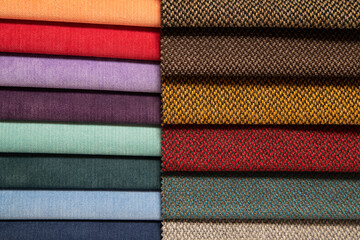 Catalog of fabrics with different colors and textures, from warm to cold colors. Catalog of fabric selection for light blinds from fabric for windows or upholstered furniture