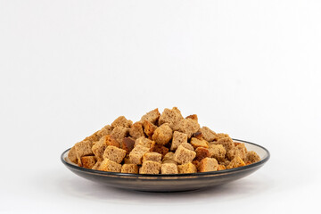 rye crackers in a plate on a white background