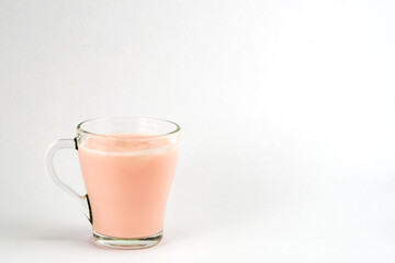 yogurt in a transparent glass on a white background