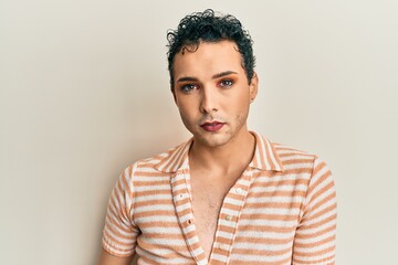 Handsome man wearing make up wearing casual shirt smiling happy pointing with hand and finger to the side
