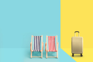 Travel suitcase and beach deck chairs