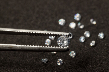 Diamonds are valuable, expensive and rare. For making jewelry. brilliant cut diamond held by...