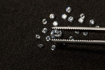 Diamonds are valuable, expensive and rare. For making jewelry. brilliant cut diamond held by...