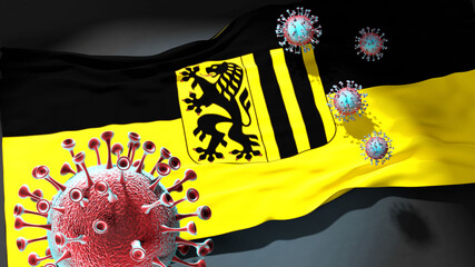 Covid in Dresden - coronavirus attacking a city flag of Dresden as a symbol of a fight and struggle with the virus pandemic in this city, 3d illustration