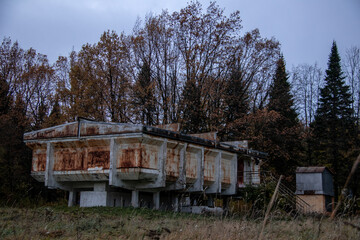 Fototapeta na wymiar strange rusty abandoned observatory building on concrete pillars