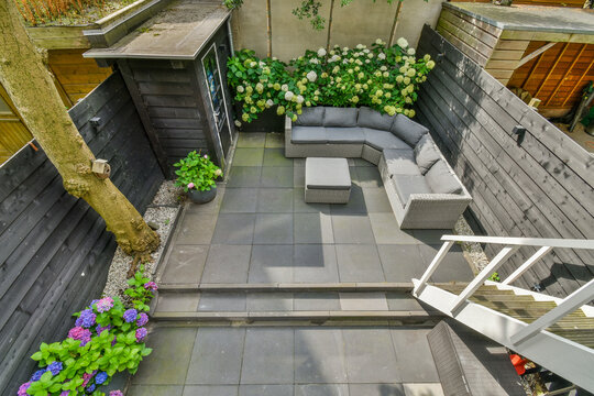 Patio with stairs against sofa and table