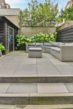Patio with stairs against sofa and table