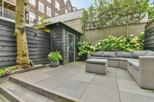 Patio with stairs against sofa and table
