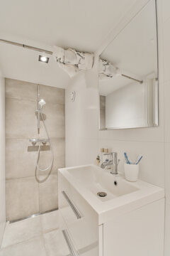 Contemporary bathroom interior with washstand under mirror at home