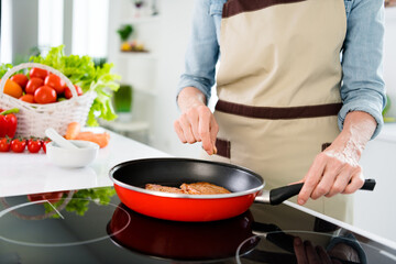 Cropped photo of charming attractive positive woman season food pepper pan smile indoors inside house home kitchen