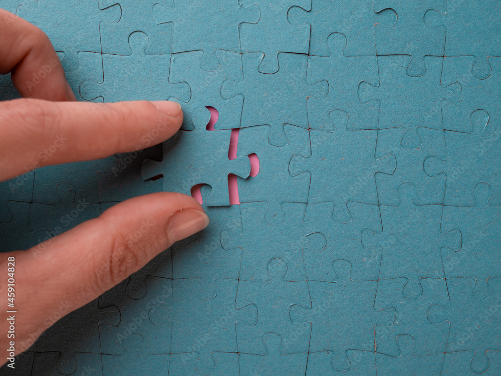 Poster solving the problem, successfully completed collecting puzzles. the fingers insert the final element