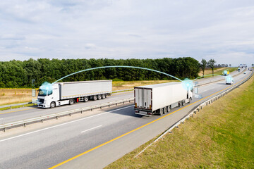 Vehicle to vehicle communication. Data exchange between trucks on a highway.