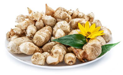 Jerusalem artichoke roots with leaves and flower of Jerusalem artichoke isolated on white background.