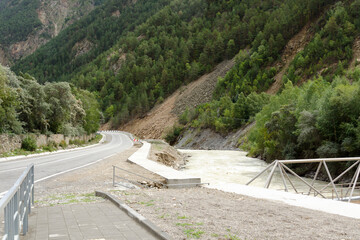 asphalt mountain road and river