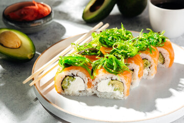 Japanese sushi rolls with salmon, shrimp, smoked eel and red caviar