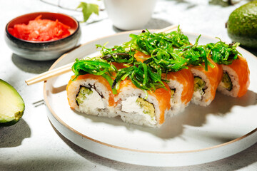 Japanese sushi rolls with salmon, shrimp, smoked eel and red caviar