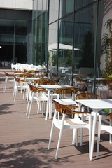 chairs in the mall on the veranda in the sun