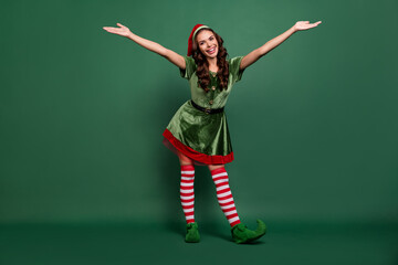 Full length body size view of attractive cheerful girl elf dancing having fun isolated over green...