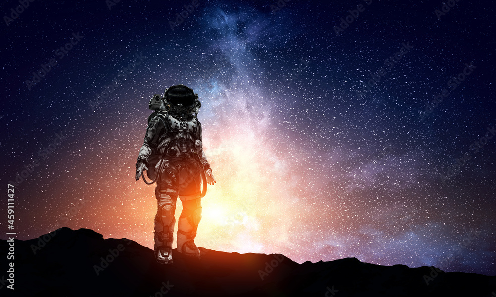 Wall mural astronaut walking on an unexplored planet