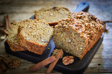 Diet baked goods made from whole grain flour and nuts. Wood background
