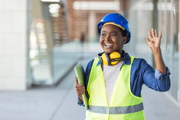 Female construction engineer. Architect with a blueprints at a construction site. Young Woman look in camera, building site place background. Portrait of adult female builder, engineer, architect, ins