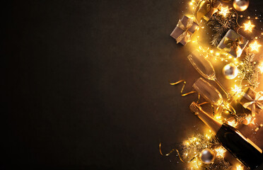 New Years Eve holiday background with fir branches, champagne bottle, christmas balls, gift box and...