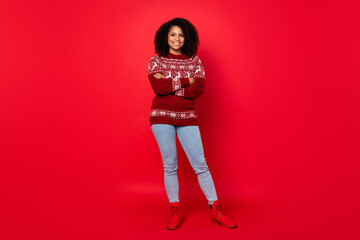 Full length body size photo woman smiling confident with crossed hands isolated bright red color background