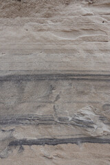 Sand layers on the beach. Photo taken in good lighting conditions on a cloudy day