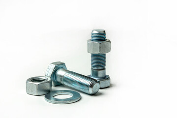 several large bolts and nuts on a white background