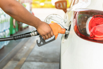 Hand Man Refill and filling Oil Gas Fuel at station. Gas station - refueling. To fill the machine with fuel. Car fill with gasoline at a gas station. Gas station pump. 