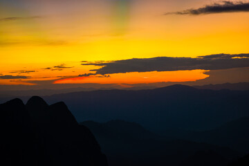 Sunset sky with cloud on top of mountain