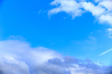 Blue summer sky with clouds. Ready for use with the Sky Replacement feature in Adobe Photoshop and for use as wallpaper. A spectacular background for your creativity.