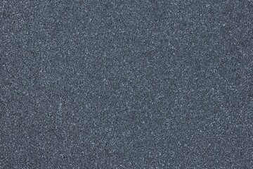 Dark grey textured surface. Black texture. Abstract gray background