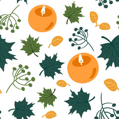 Fall background of green leaves and warm candles.
